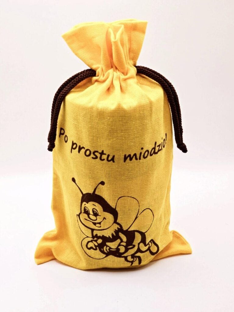Opis: Naturalne miód w ozdobnym opakowaniu z uśmiechniętym pszczółką, idealne na prezent.